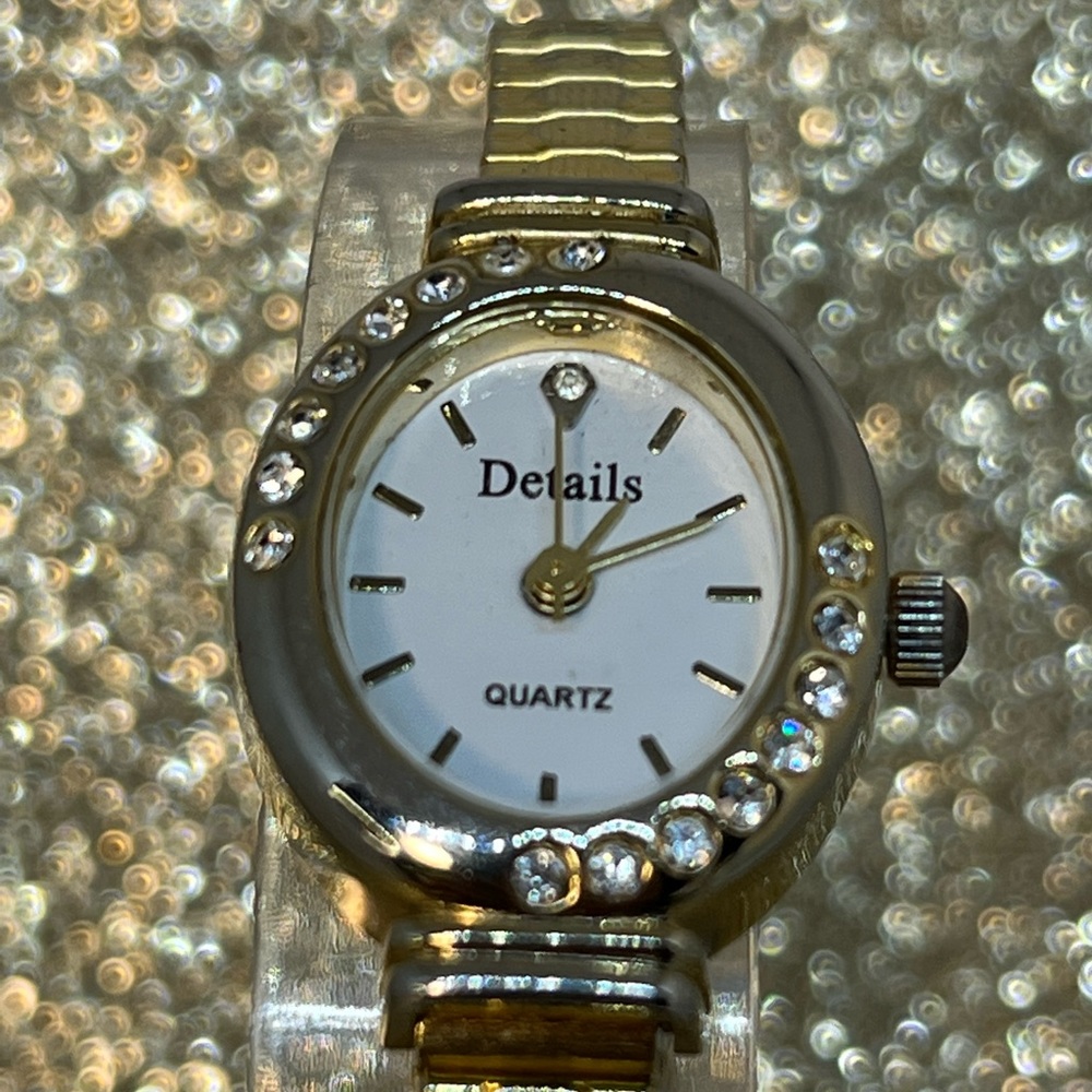 DETAILS a beautiful, petite watch with a stretchy band and cute gems around it!